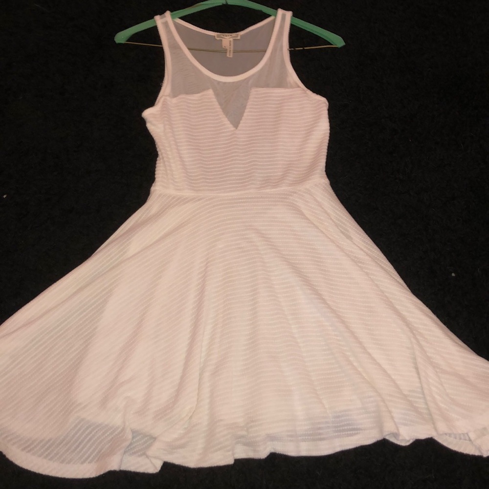 White skater dress with deep cut back and v front
